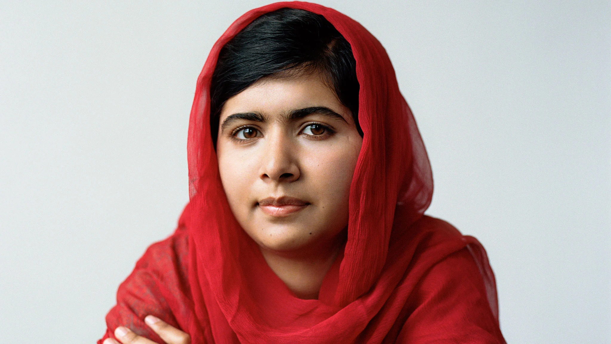 Portrait of Malala Yousafzai, symbolizing her strength, resilience, and advocacy for girls' education, highlighting her journey from a young activist in Pakistan to a global icon.